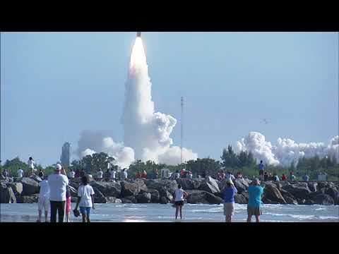 Spectators at Jetty Park in Cape Canaveral watch a Delta 2 rocket launching NASA’s GRAIL mission